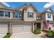 Charming townhome with brick and siding exterior, inviting front entrance and two-car garage at 5014 Forest Hills Pl, Fort Mill, SC 29707