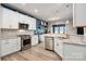 Bright eat-in kitchen with white cabinets, granite counters, and stainless appliances at 5014 Forest Hills Pl, Fort Mill, SC 29707