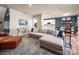 Bright and airy open-concept living room with hardwood flooring and seamless transition to kitchen and dining areas at 5014 Forest Hills Pl, Fort Mill, SC 29707