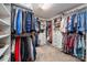 Spacious walk-in closet with custom shelving, hanging racks, and ample storage space for organization at 5014 Forest Hills Pl, Fort Mill, SC 29707