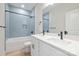 Stylish bathroom with a double vanity, modern fixtures, and a tiled shower/tub combination at 515 Dixie Dr, Mooresville, NC 28115