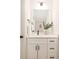 Cozy bathroom with a single vanity, modern black fixtures, and neutral decor at 515 Dixie Dr, Mooresville, NC 28115