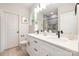 Bright bathroom featuring double vanity, modern fixtures, and a walk-in shower with gray tile at 515 Dixie Dr, Mooresville, NC 28115