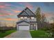 Newly built two-story home with a well-maintained lawn and driveway at 515 Dixie Dr, Mooresville, NC 28115