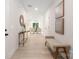Inviting hallway with light wood floors, bench seating, and an entryway into the bright living room at 515 Dixie Dr, Mooresville, NC 28115