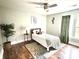 Cozy bedroom featuring hardwood floors, ceiling fan and neutral paint at 520 Beacon Knoll Ln, Fort Mill, SC 29708