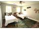 This bedroom offers 2 beds, hardwood floors, 2 windows, and unique decorations at 520 Beacon Knoll Ln, Fort Mill, SC 29708