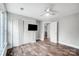Spacious bedroom with wood floors, neutral paint, closet, and a ceiling fan at 520 Beacon Knoll Ln, Fort Mill, SC 29708