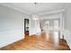 Dining room with hardwood floors, crown molding, and a decorative light fixture, perfect for Gathering dinners at 520 Beacon Knoll Ln, Fort Mill, SC 29708