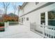 Back of home with second story deck, backyard basketball court and freshly painted neutral stucco at 520 Beacon Knoll Ln, Fort Mill, SC 29708