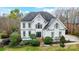 Charming two-story home featuring a well-manicured lawn and a classic architectural design with neutral colors at 520 Beacon Knoll Ln, Fort Mill, SC 29708