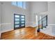 Spacious foyer with dark double doors and gleaming wood floors at 520 Beacon Knoll Ln, Fort Mill, SC 29708