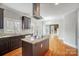 Bright and airy kitchen with granite countertops, stainless steel appliances, and access to the adjoining living area at 520 Beacon Knoll Ln, Fort Mill, SC 29708