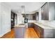 Modern kitchen with granite countertops, stainless steel appliances, a center island, and dark wood cabinets at 520 Beacon Knoll Ln, Fort Mill, SC 29708