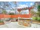 Outdoor kitchen area with grill, bar, fire pit, seating, and custom stonework at 520 Beacon Knoll Ln, Fort Mill, SC 29708