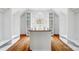 Large walk-in closet with hardwood floors, center island, granite countertop, and custom shelving at 520 Beacon Knoll Ln, Fort Mill, SC 29708
