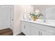 Bright bathroom featuring double sinks, quartz countertop, and a large mirror at 5540 Pamplona Way, Charlotte, NC 28214