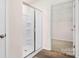 New bathroom features a glass-enclosed shower and easy access to the walk-in closet at 5540 Pamplona Way, Charlotte, NC 28214