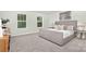 Inviting primary bedroom showcasing neutral walls, side tables, and soft carpeting at 5540 Pamplona Way, Charlotte, NC 28214