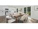 Stylish dining area with seating near the kitchen and sliding glass doors to the patio at 5540 Pamplona Way, Charlotte, NC 28214