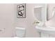 Elegant powder room features modern fixtures, a stylish round mirror, and neutral decor at 5540 Pamplona Way, Charlotte, NC 28214