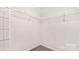 Spacious walk-in closet featuring wire shelving for organized storage at 5540 Pamplona Way, Charlotte, NC 28214