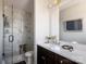 Elegant bathroom features a walk-in shower with marble tiling and stylish fixtures at 6013 Pivot Ct, Charlotte, NC 28205