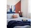 Cozy bedroom featuring a bed with blue bedding and rust-colored accents for a modern feel at 6013 Pivot Ct, Charlotte, NC 28205