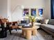 Comfortable living room features eclectic decor, blue accents, and plentiful natural light at 6013 Pivot Ct, Charlotte, NC 28205
