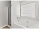 A soaking tub is the focal point in this bath with a shower at 8309 Shinkansen Dr, Charlotte, NC 28213