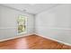 Bedroom featuring a window, light paint and plank flooring at 8309 Shinkansen Dr, Charlotte, NC 28213