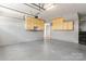 Well-lit garage with storage cabinets at 8309 Shinkansen Dr, Charlotte, NC 28213