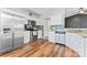 Kitchen features stainless appliances, white cabinets, and granite countertops at 8309 Shinkansen Dr, Charlotte, NC 28213