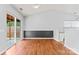 Open-concept living room with wood floors, slider to the outdoors and ample light at 8309 Shinkansen Dr, Charlotte, NC 28213