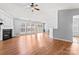 Open-concept living area featuring fireplace, high ceilings, and sliding doors to the backyard at 8309 Shinkansen Dr, Charlotte, NC 28213