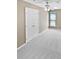 Bright bedroom with plush carpet, closet, neutral walls, and a ceiling fan at 903 Furman Ct, Fort Mill, SC 29708