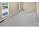 Spacious bedroom with plush carpeting, large windows, and neutral wall paint at 903 Furman Ct, Fort Mill, SC 29708