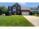 Attractive brick home with a well-manicured lawn, black shutters, and a two-car garage at 903 Furman Ct, Fort Mill, SC 29708