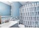 Cozy bathroom featuring a sink, toilet, and stylish shower curtain at 9051 Country Barn Ct, Charlotte, NC 28273