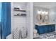 Stylish bathroom featuring double sinks, round mirrors, shiplap, and tiled floors at 9051 Country Barn Ct, Charlotte, NC 28273