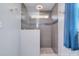 Modern bathroom with tiled shower and unique tile flooring at 9051 Country Barn Ct, Charlotte, NC 28273
