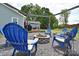 Charming fire pit area with Adirondack chairs for cozy gatherings in the backyard at 9051 Country Barn Ct, Charlotte, NC 28273