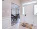 Inviting foyer with tile flooring, white trim, and a clear view into the dining area at 9051 Country Barn Ct, Charlotte, NC 28273