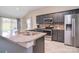 Well-equipped kitchen with a large island, stainless steel appliances, and a granite countertop at 9051 Country Barn Ct, Charlotte, NC 28273