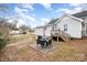 Backyard with a patio, grill, and stairs to the deck, ideal for relaxation and outdoor gatherings at 92 Saint Charles Ne Ave, Concord, NC 28025