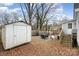 The backyard offers an outdoor shed, a patio set, and a secure fence for enjoyable outdoor activities at 92 Saint Charles Ne Ave, Concord, NC 28025