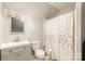 This cozy bathroom has a shower with curtain, a vanity sink, and neutral decor for a clean appearance at 92 Saint Charles Ne Ave, Concord, NC 28025