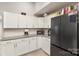 Bright kitchen features white cabinets, granite countertops, and stainless steel appliances at 92 Saint Charles Ne Ave, Concord, NC 28025