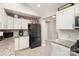 Bright kitchen features white cabinets, granite countertops, and stainless steel appliances at 92 Saint Charles Ne Ave, Concord, NC 28025