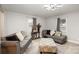Inviting living room features modern gray sofas, a patterned ottoman, and bright natural light at 92 Saint Charles Ne Ave, Concord, NC 28025
